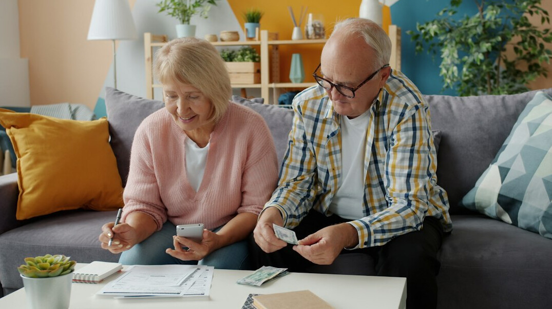 elderly couple with advisor